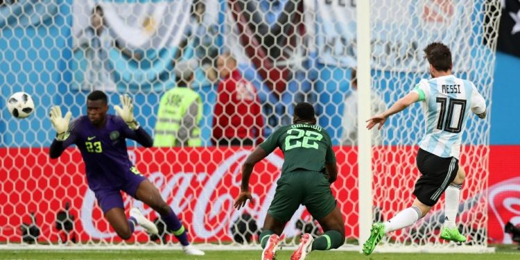 Lionel Messi (No.10) watches as the ball is about to beat Nigerian keeper Francis Uzoho for Argentina’s first goal, Tuesday