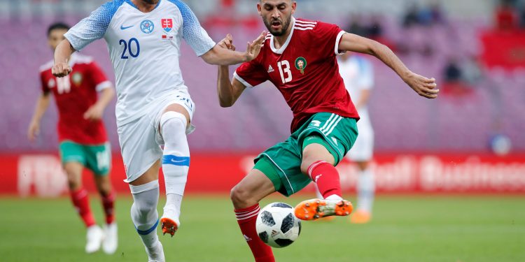 Morocco's Khalid Boutaib (R) vies for the ball with Slovakia’s Robert Mak during their international friendly match, Monday