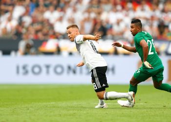 Joshua Kimmich (L) in action with Saudi Arabia's Salem Al-Dawsari, Saturday