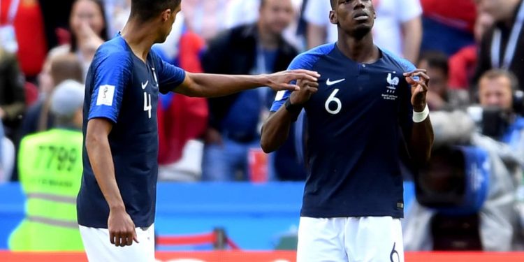 Paul Pogba (R) celebrates with a teammate after scoring France's second goal against Australia