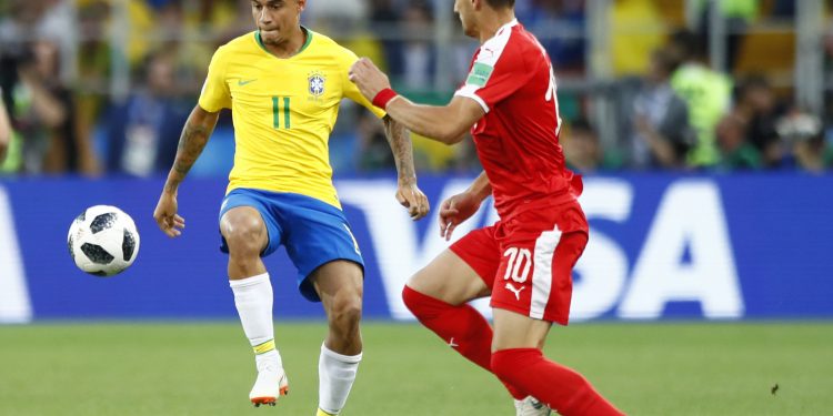Brazil's Philippe Coutinho  (L) controls the ball past Serbia's Dusan Tadic during their group E match at the Spartak Stadium in Moscow, Wednesday