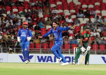 Rashid Khan celebrates after dismissing a Bangladeshi batsman, Tuesday