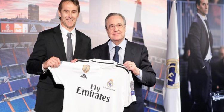 Real Madrid president Florentino Perez hands new manager the club jersey during the unveiling