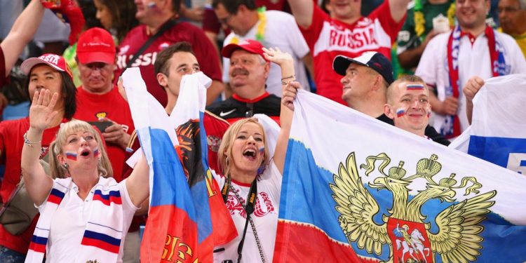 Russian fans celebrate after their win against Saudi Arabia in the World Cup opener in Moscow, Thursday