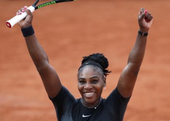 Serena Williams celebrates after defeating Julia Georges during their third round match of the French Open tennis tournament, Saturday