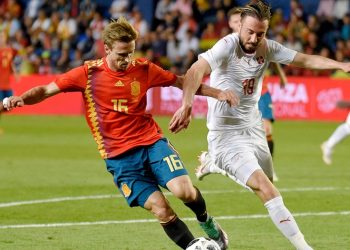 Spain's Nacho Monreal (L) viesfor the ball with Switzerland's Josip Drmic during their international friendly  match. Sunday