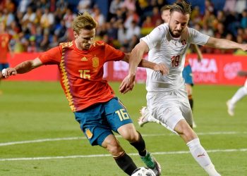 Spain's Nacho Monreal (L) viesfor the ball with Switzerland's Josip Drmic during their international friendly  match. Sunday