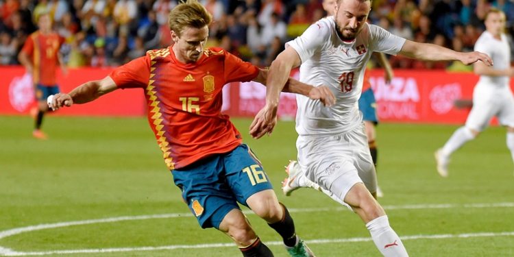 Spain's Nacho Monreal (L) viesfor the ball with Switzerland's Josip Drmic during their international friendly  match. Sunday