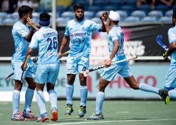 Varun Kumar (2nd right) is congratulated by teammates after scoring India’s first goal against Australia, Wednesday