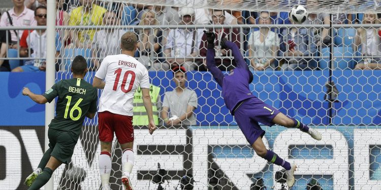 Christian Eriksen of Denmark watches as his stunning volley beats the Aussie shotstopper to give his side the lead at Samara, Thursday