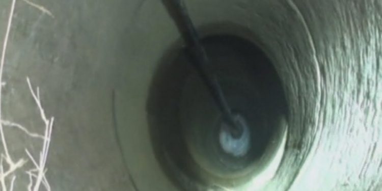 Mother jumps into well and saves her son