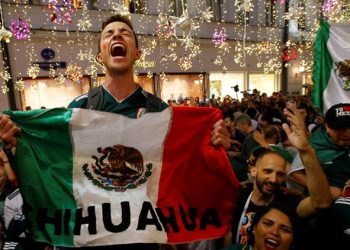 Mexican fans celebrate after their team's win against Germany, Sunday