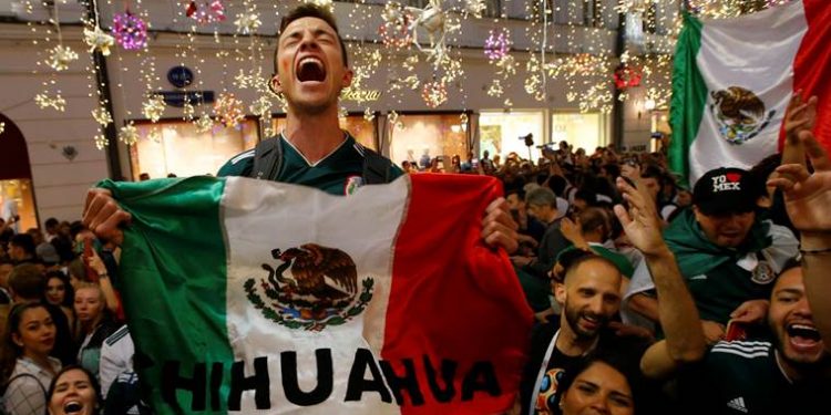 Mexican fans celebrate after their team's win against Germany, Sunday