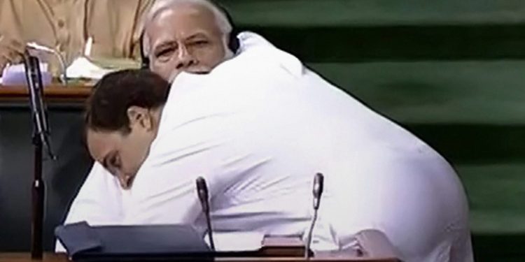 New Delhi: Congress President Rahul Gandhi hugs Prime Minister Narendra Modi after his speech in the Lok Sabha on 'no-confidence motion' during the Monsoon Session of Parliament, in New Delhi on Friday, July 20, 2018. (LSTV GRAB via PTI)(PTI7_20_2018_000081B)