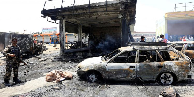 Afghan security forces inspect the site of a suicide attack in Jalalabad city, Afghanistan July 10, 2018. REUTERS/Parwiz