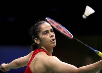 Saina Nehwal of India plays a shot against Aliye Demirbag of Turkey during their women's badminton singles match at the BWF World Championships, Tuesday