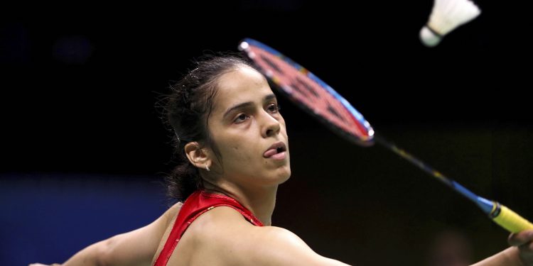 Saina Nehwal of India plays a shot against Aliye Demirbag of Turkey during their women's badminton singles match at the BWF World Championships, Tuesday