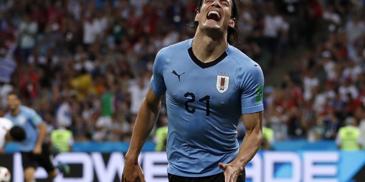 Edinson Cavani celebrates after scoring the opener against Portugal at the Fisht Stadium in Sochi