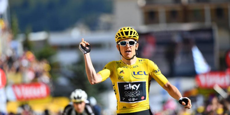 Geriant Thomas celebrates as he crosses the finish line to win the 12th stage of the Tour de France, Friday