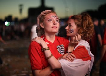 England fans react after their loss against Croatia in the World Cup semifinal in Hyde Park, London, Wednesday