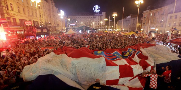 Croatia fans celebrate at the end of the semifinal win over England, in Zagreb, Wednesday