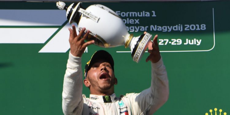 Lewis Hamilton celebrates with the Hungarian GP tittle, Sunday