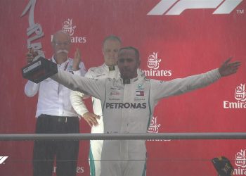 Lewis Hamilton celebrates with the German GP trophy, Sunday