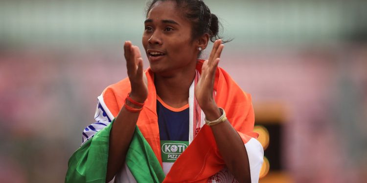 Hima Das of India celebrates winning gold in the final of the women's 400m in IAAF World U-20 Championships