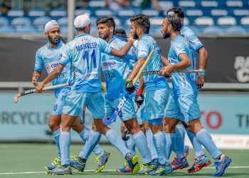 Indian players celebrate after scoring their first goal against Australia in the final at Breda, Sunday   