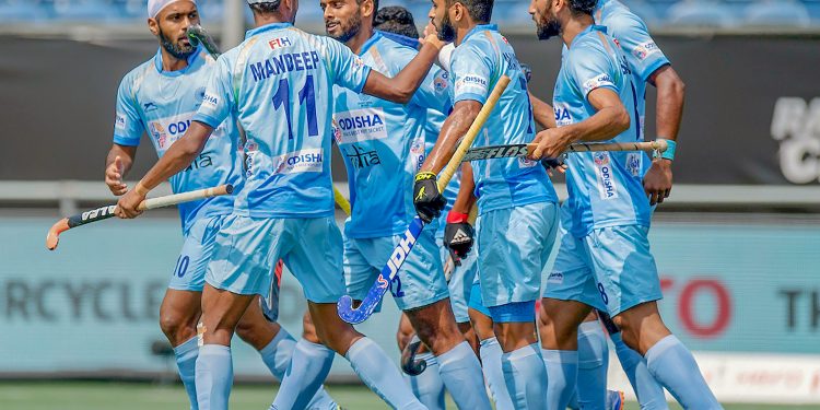 Indian players celebrate after scoring their first goal against Australia in the final at Breda, Sunday   