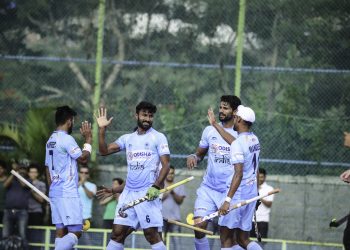 Surender Kumar (C) celebrates with teammates after scoring against New Zealand, Sunday