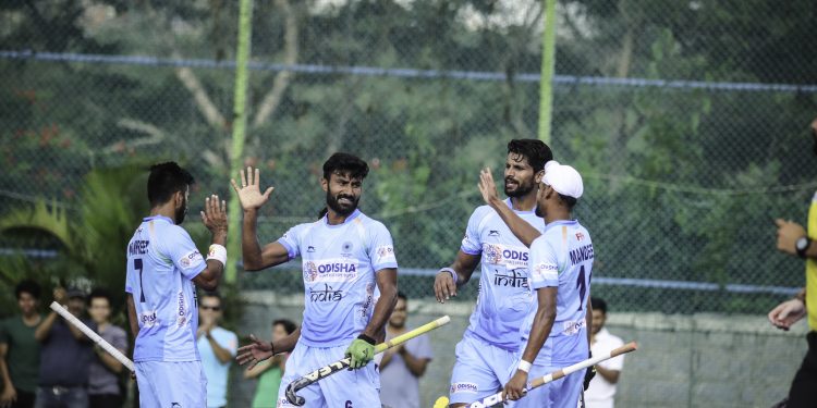 Surender Kumar (C) celebrates with teammates after scoring against New Zealand, Sunday