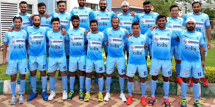 Indian hockey team players selected Monday for the Asian Games pose in New Delhi 