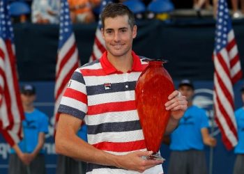 John Isner poses with the Atlanta Open trophy, Monday