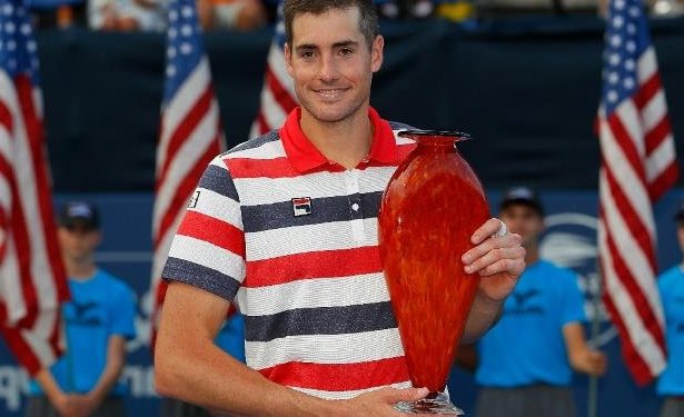 John Isner poses with the Atlanta Open trophy, Monday