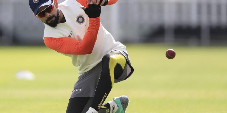 India captain Virat Kohli goes through some catching practice during their training session in Birmingham, Monday