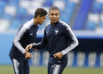 Kylian Mbappe smiles as he warms up during France's training session at Nizhny Novgorod