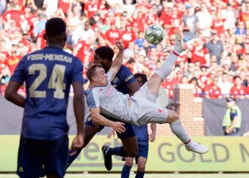 Xherdan Shaqiri (C) scores from an overhead bicycle-kick against Manchester United, Saturday