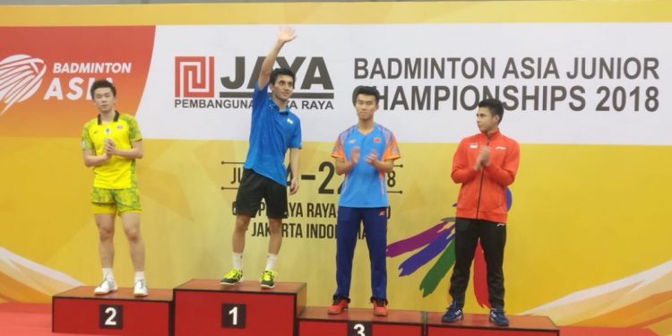 Lakshya Sen (hands raised) receives applause from spectators on the podium after winning men’s single’s gold at Asia Junior Badminton Championships in Jakarta, Sunday