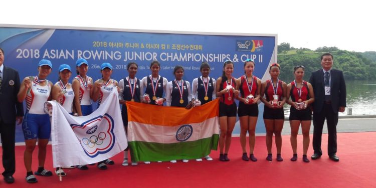 Indian team comprising of four Odisha players (C) pose with the Tricolour and their gold medals at Chungju, Friday