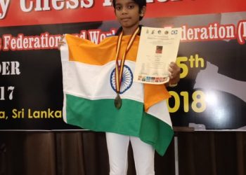 Arushi Srichandan poses with one of her medals and a certificate at Colombo, Saturday 
