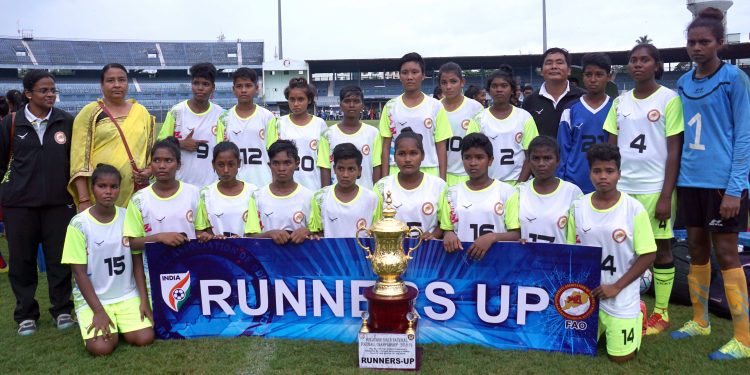 Odisha players pose with the runners-up trophy at Cuttack, Thursday         
