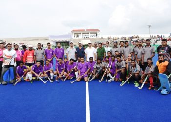 Central Zone A and South Zone A players and officials pose for a photograph before the start of their match at KIIT Hockey Stadium, Tuesday