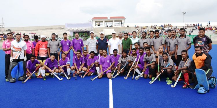 Central Zone A and South Zone A players and officials pose for a photograph before the start of their match at KIIT Hockey Stadium, Tuesday