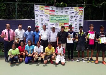 Winners pose with their trophies and certificates along with guests at the Kalinga Stadium tennis complex, Friday 