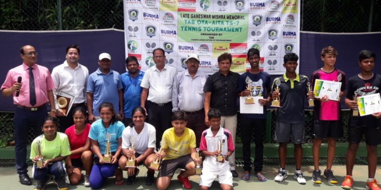 Winners pose with their trophies and certificates along with guests at the Kalinga Stadium tennis complex, Friday 