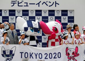 Tokyo 2020 organising committee president Yoshiro Mori and Tokyo Governor Yuriko Koike pose for a group photo with Olympic Games mascot Miraitowa and Paralympics mascot Someity in Tokyo, Japan, Sunday