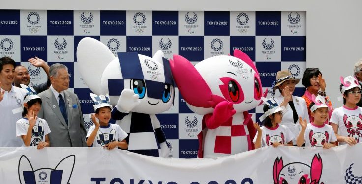 Tokyo 2020 organising committee president Yoshiro Mori and Tokyo Governor Yuriko Koike pose for a group photo with Olympic Games mascot Miraitowa and Paralympics mascot Someity in Tokyo, Japan, Sunday