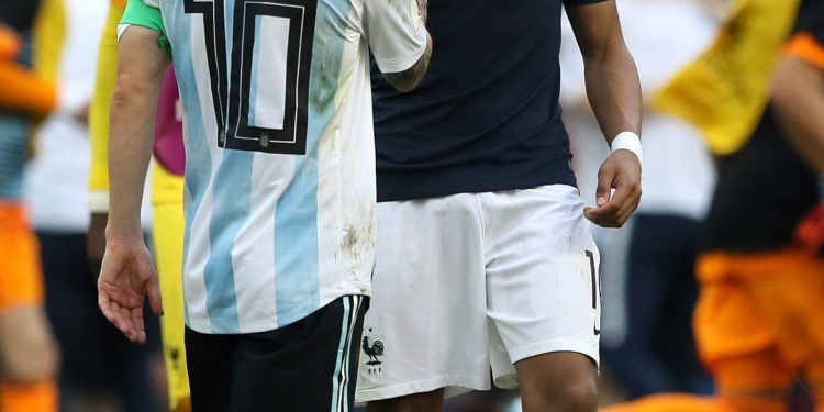 Argentina’s Lionel Messi congratulates France’s Kylian Mbappe (R) after their match at Kazan, Saturday