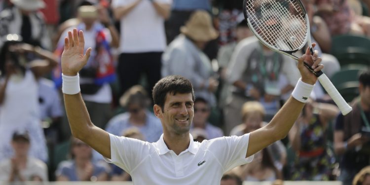 Novak Djokovic is all smiles after his second round win at Wimbledon, Thursday